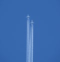 Two jet two-turbine aircraft in flight on blue sky background Royalty Free Stock Photo