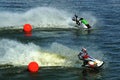 Two jetskis riding from red balls Royalty Free Stock Photo