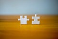 Two jigsaw pawns on de wooden worwd desk. Harmony Teamwork I will always help. Royalty Free Stock Photo