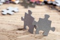 Two jigsaw puzzle pieces on table Royalty Free Stock Photo