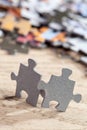 Two Jigsaw Puzzle Pieces on Table Royalty Free Stock Photo