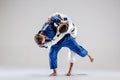 The two judokas fighters fighting men Royalty Free Stock Photo