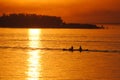 two kayakers on the river at sunset Royalty Free Stock Photo