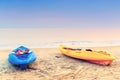 Two kayaks on the beach early in the morning. Royalty Free Stock Photo