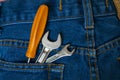 Two keys and a screwdriver in the pocket of his blue jeans Royalty Free Stock Photo