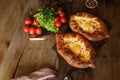 Khachapuri Adjara traditional Georgian dishes. Baked bread stuffed with cheese and eggs.