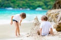 Two kid boys building sand castle on tropical beach Royalty Free Stock Photo