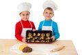 Two kids with baking on oven-tray