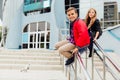 Two kids: Beautiful Children play on the railing in the street on the stairs. Royalty Free Stock Photo