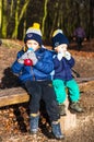 Two kids on a bench.