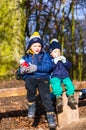 Two kids on a bench.