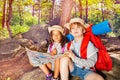 Two kids in forest navigate with map treasure hunt Royalty Free Stock Photo