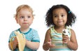 Two kids boy and girl eading fruit and ice cream