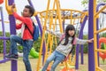 Two kids boy and girl having fun to play on children`s climbing Royalty Free Stock Photo