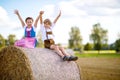 Two kids, boy and girl in traditional Bavarian costumes in wheat field Royalty Free Stock Photo