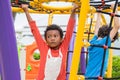 Two kids boy having fun to play on children`s climbing toy at sc Royalty Free Stock Photo