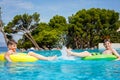 Two kids boys having fun on inflatable rubber rings in outdoor pool. Summer holiday. Summertime kids weekend. Children Royalty Free Stock Photo