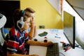 Two kids boys playing computer games on desktop pc. Modern addict activity for children. Siblings and friends gaming at Royalty Free Stock Photo