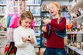 Two kids buying toys in toy store