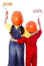 Two kids in coveralls with paint rollers Royalty Free Stock Photo