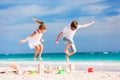 Two kids crushing sandcastle Royalty Free Stock Photo