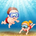 Two kids diving underwater