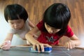 Two kids drawing on blackboard