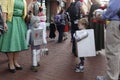 Two kids, dressed as robots, safely trick or treat along Pearl street