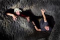 Two Kids Exploring Cave