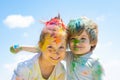 Two kids with face smeared with colors. Poor funny children playing holi. Royalty Free Stock Photo