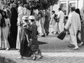 Two kids going to the prayer of Aid Al Adha 2022 in Marrakech, Morocco, Black and White