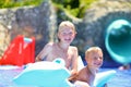 Two kids having fun in summer swimming pool Royalty Free Stock Photo