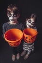 Two kids holding pumpkin buckets at Halloween Royalty Free Stock Photo