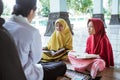 two kids learning to read quran with muslim teacher or ustad Royalty Free Stock Photo