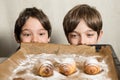 Kids looking at freshly baked spiral cookies