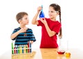 Two kids making chemical experiment Royalty Free Stock Photo