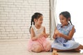 Two kids play with toy blocks on the floor of the children room. Royalty Free Stock Photo