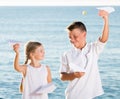 Two kids playing paper planes Royalty Free Stock Photo