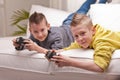 Two kids playing video games Royalty Free Stock Photo