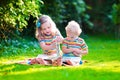 Two kids reading in summer garden Royalty Free Stock Photo