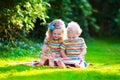 Two kids reading in summer garden Royalty Free Stock Photo