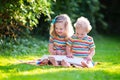 Two kids reading in summer garden Royalty Free Stock Photo