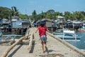 Two kids running away on the pier Royalty Free Stock Photo