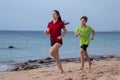 Two kids running together at morning exersises Royalty Free Stock Photo