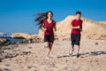 Two kids running together at morning exersises Royalty Free Stock Photo