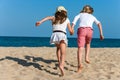 Two kids running together outdoors. Royalty Free Stock Photo