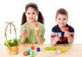 Two kids showing painted easter eggs