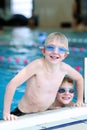 Two kids swimming in the pool Royalty Free Stock Photo