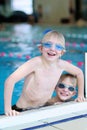 Two kids swimming in the pool Royalty Free Stock Photo