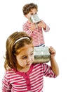 Two kids talking on a tin phone Royalty Free Stock Photo